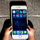 An iPhone 6, in the hands of someone who loves a small iPhone.